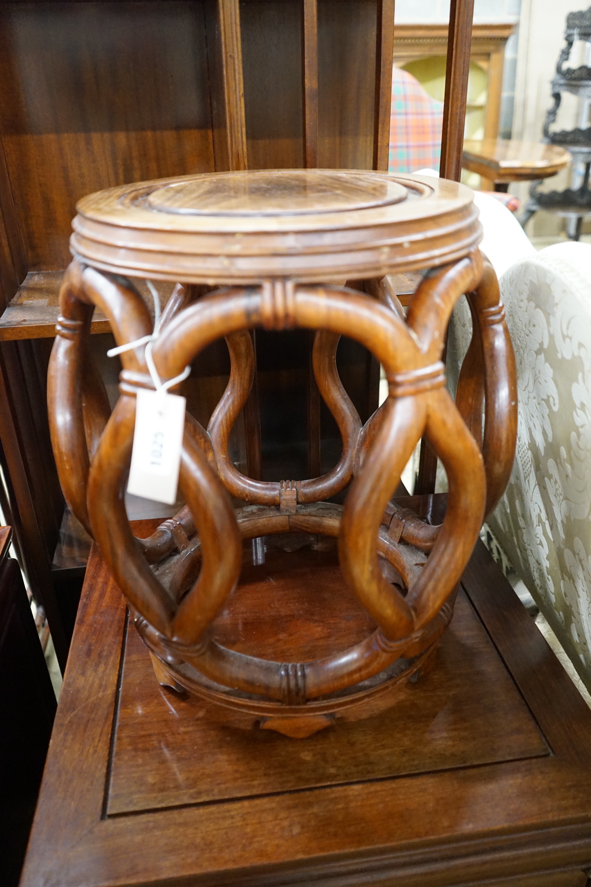 A pair of Chinese padouk wood jardiniere stands, diameter 38cm, height 46cm